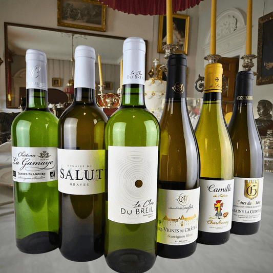 Organic French white wine discovery case featuring six unique bottles in elegant setting.